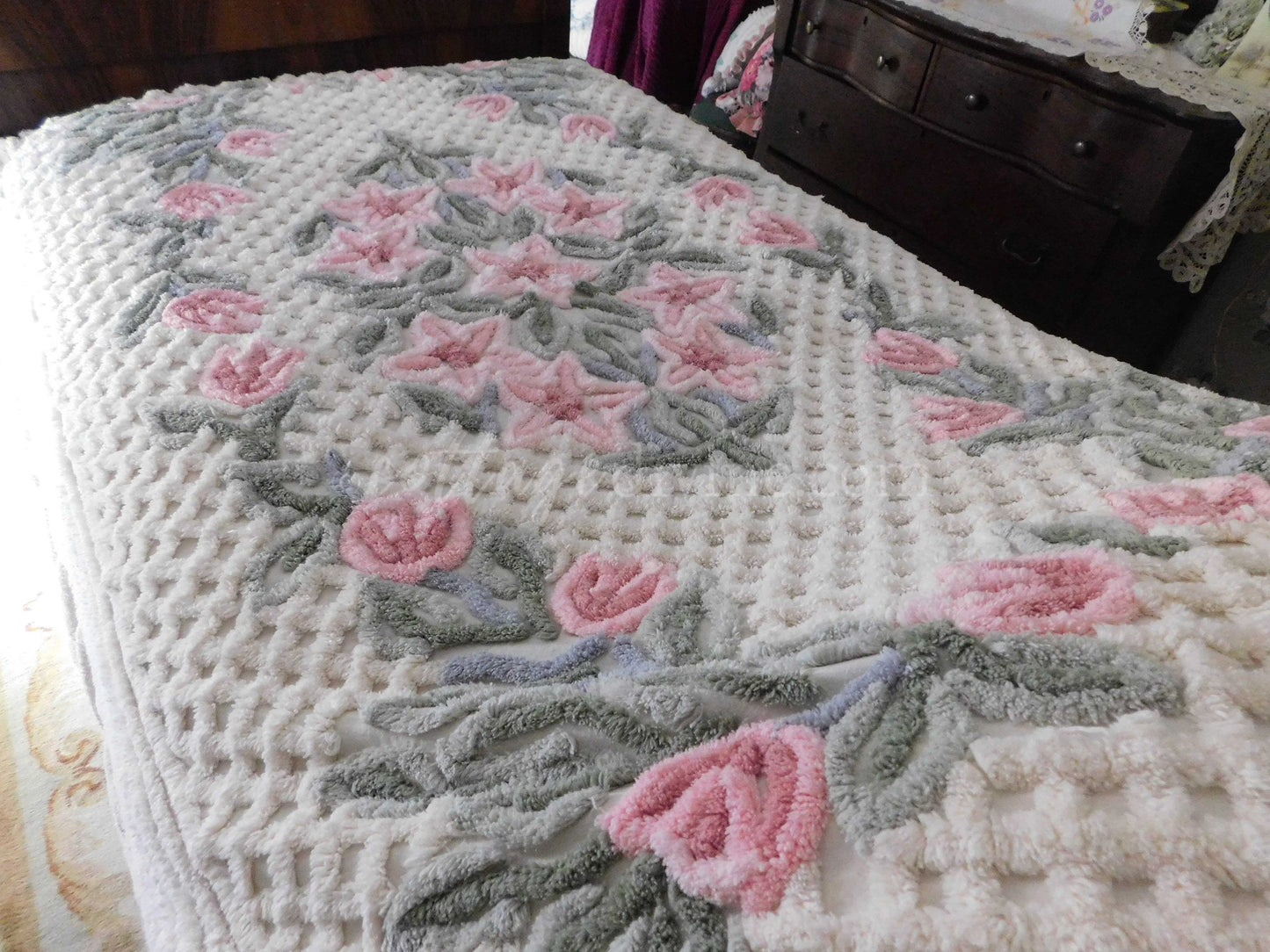 vintage chenille bedspread in a lush garden of pink lilies, buttercream twin size bedding, fitted design with ruffle skirt