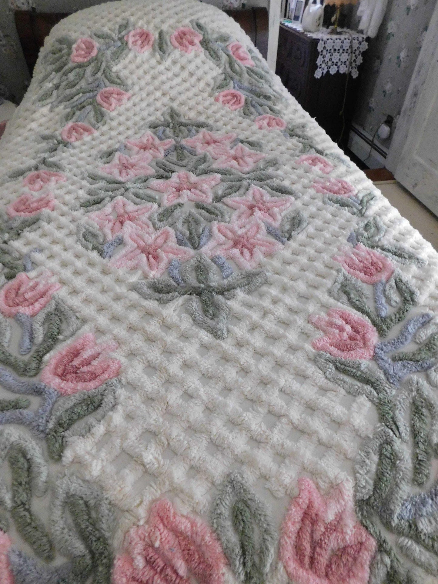 vintage chenille bedspread in a lush garden of pink lilies, buttercream twin size bedding, fitted design with ruffle skirt
