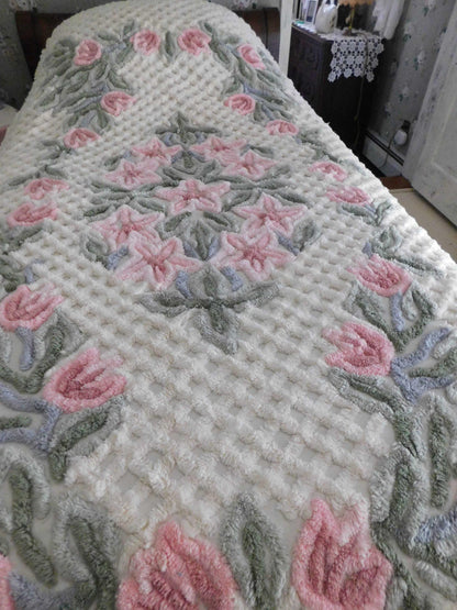 vintage chenille bedspread in a lush garden of pink lilies, buttercream twin size bedding, fitted design with ruffle skirt