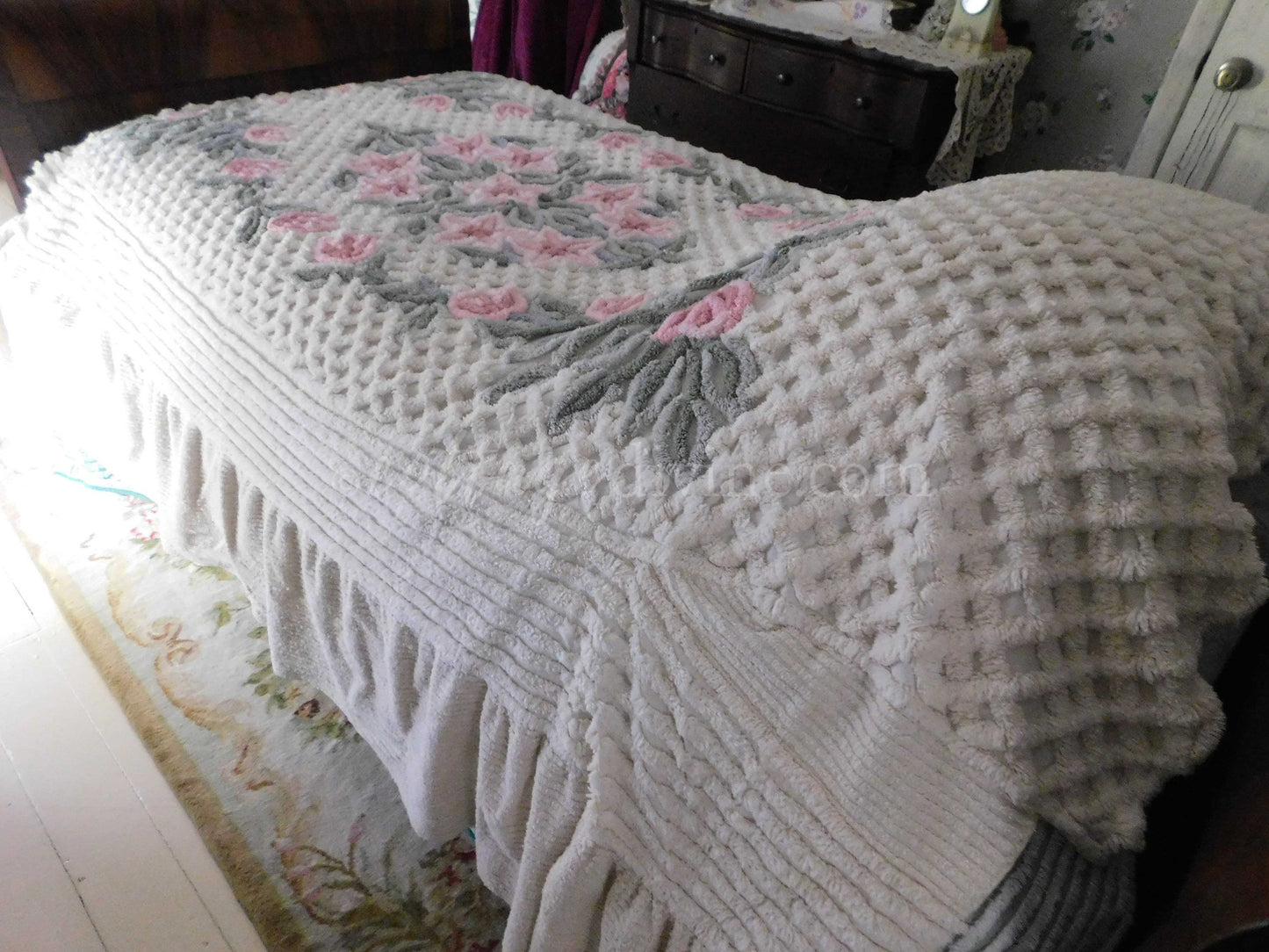 vintage chenille bedspread in a lush garden of pink lilies, buttercream twin size bedding, fitted design with ruffle skirt