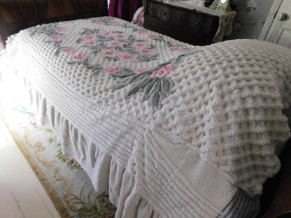 vintage chenille bedspread in a lush garden of pink lilies, buttercream twin size bedding, fitted design with ruffle skirt
